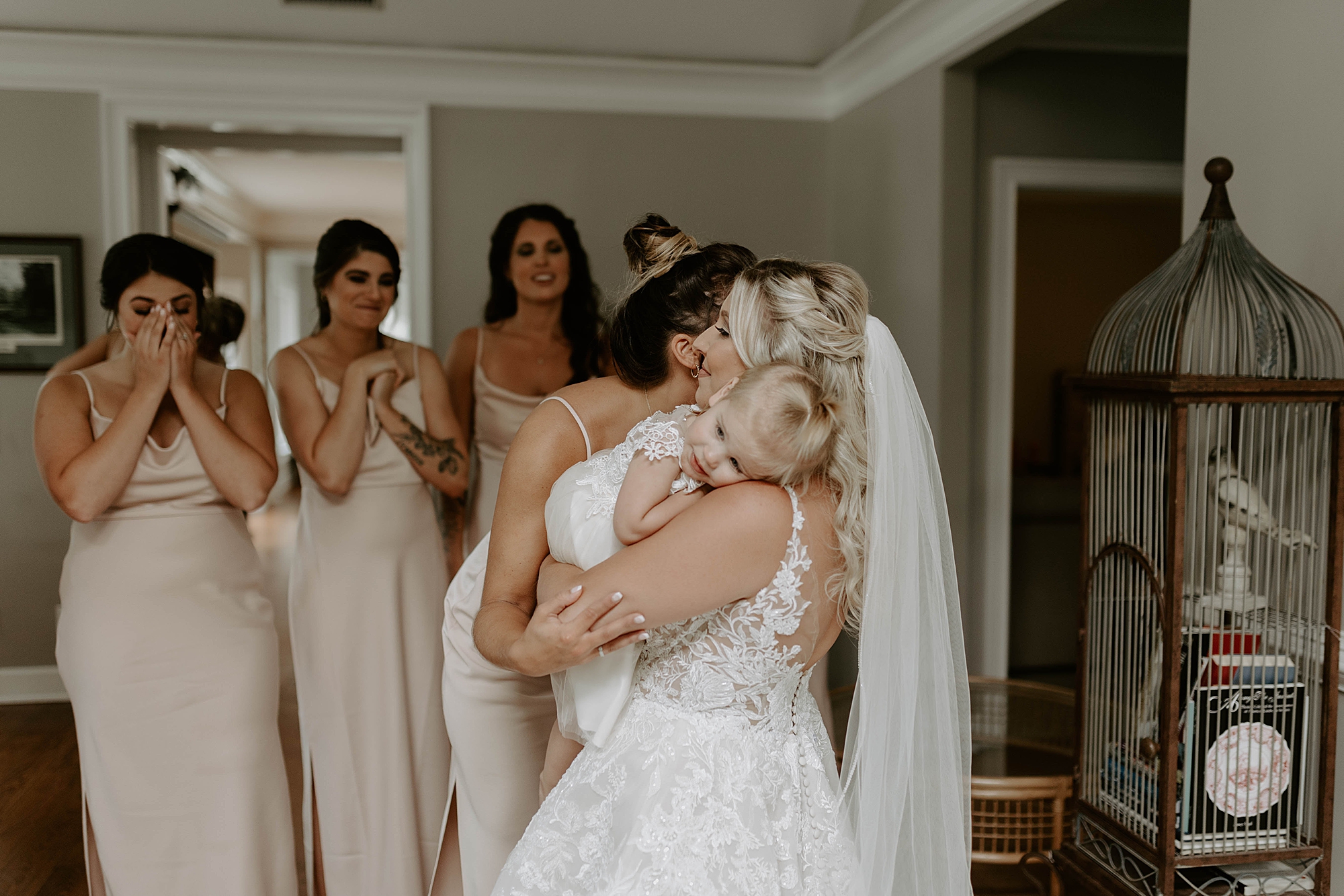 first look with bridesmaids and daughter